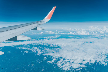 Wall Mural - Beautiful view from airplane window and blue sky on nice sunny day, This time in altitude during flight.