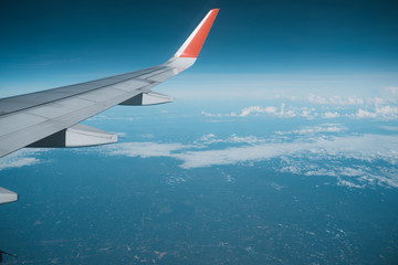 Wall Mural - Beautiful view from airplane window and blue sky on nice sunny day, This time in altitude during flight.