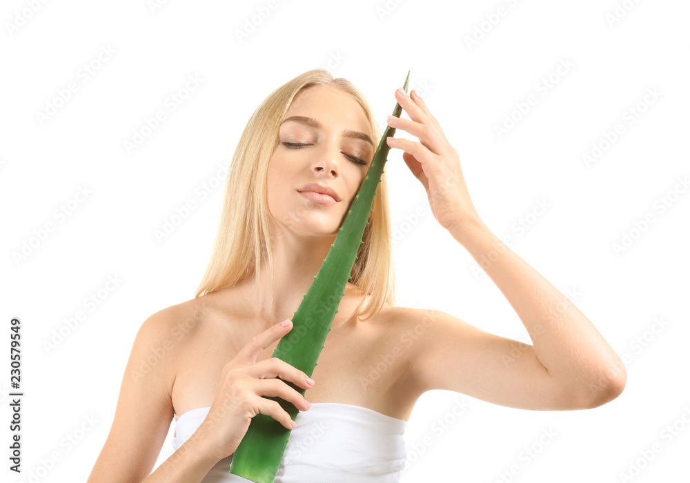 Beautiful young woman with aloe vera on white background