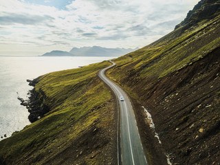 car driving on beautiful road, travel background, aerial scenic landscape from iceland