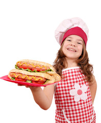 little girl cook with hot dogs fast food