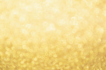 Abstract Gold glitter festive Christmas texture background blur with bokeh light