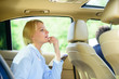 © be free - Business woman sit on backseat. Busy lady passenger leather car salon enjoy journey with chauffeur. Business lady passenger luxury car salon. Personal assistant and driver. Business life concept