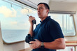© Denys Yelmanov  - Portrait of navigator / pilot / officer on the bridge of the vessel