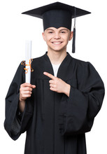Portrait Of A Graduate Teen Boy Student In A Black Graduation Gown With Hat, Holding Diploma - Isolated On White Background. Child Back To School And Educational Concept.