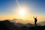 Fototapeta  - Woman hiking success silhouette in mountains sunset