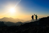 Fototapeta  - Couple hikers celebrating success concept in mountains