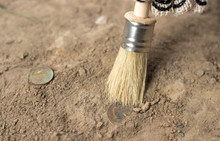  Archeology Female Hand Holds Brush A Tassel Excavation Of Rare Materials Treasure Hunt And Archeology Find Rare  Gold Coins In Sand 