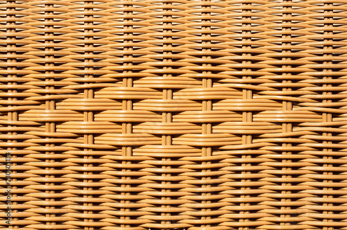 Fotografía Closeup of decorated wicker basket or rattan chair textured background with desi