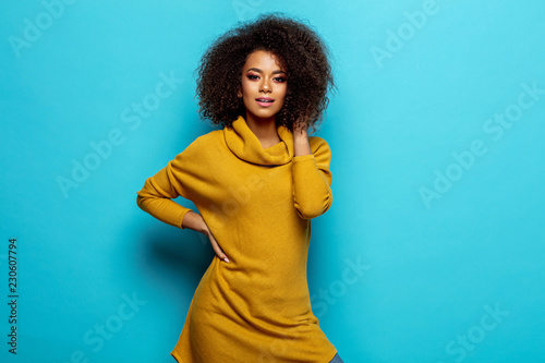 Fotomural Beautiful african american woman wear cardigan looking at camera
