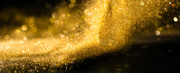 Wall Mural - glitter lights grunge background, gold glitter defocused abstract twinkly lights background.