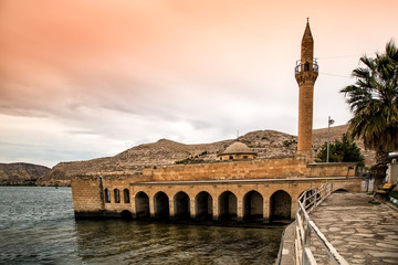 Wall Mural - Landscape of Halfeti  in the foreground Euphrates River and Sunken Mosque. Halfeti is a touristic area between Gaziantep and Sanliurfa in Turkey.