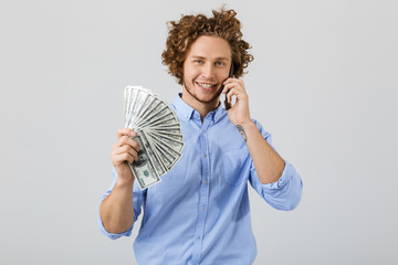 Poster - Portrait of a cheerful young man with curly hair