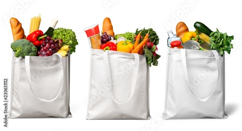Cuadros en Lienzo Shopping bags with groceries isolated on white