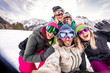 © oneinchpunch - Group of snowboarders on winter holiday