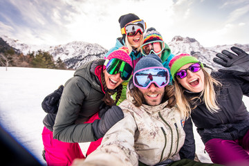 Group of snowboarders on winter holiday