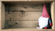 © magann - Christmas decoration with a gnome in a wooden box background