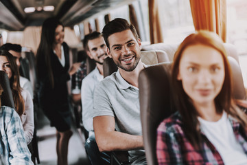 Sticker - Young Smiling Man Traveling on Tourist Bus