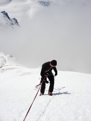 Canvas Print - mountain climber rappelling off s steep snowy mountain peak in the Swiss Alps above Zermatt