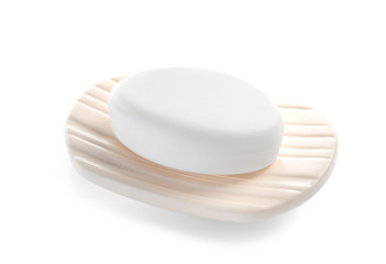 Holder with soap bar on white background