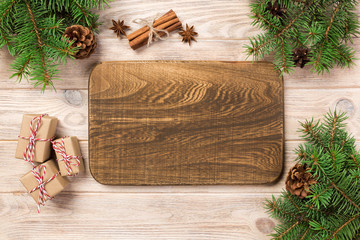 Sticker - wood cutting board at table background with christmas decoration, Round board. New Year concept