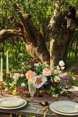 wedding decorated table, decor wedding dinner in nature in the garden