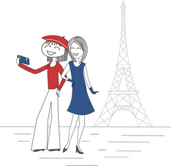 Wall Mural - Two women take pictures of themselves with a mobile phone in Paris in front of the Eiffel Tower