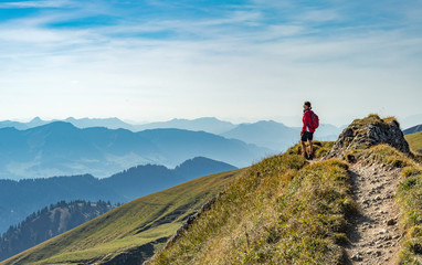 nice senior woman, hiking in fall, autumn on the ridge of the nagelfluh chain near oberstaufen, allg