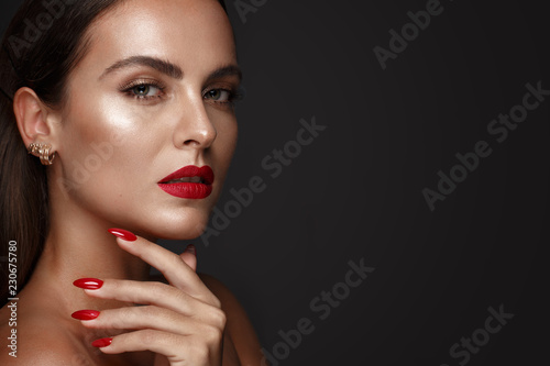 Leinwand Poster Beautiful girl with a classic make up and multi-colored nails