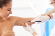 © Kalim - Plastic surgeon making marks on patient's body