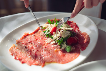 Wall Mural - Red beef carpaccio in a white plate,