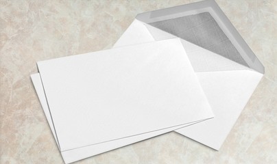 Wall Mural - Blank white envelope and card on wooden background