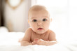 © Louis-Paul Photo - A Cute baby girl on a white bed at home
