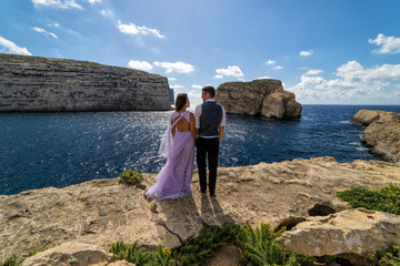 Sticker - Wedding photography - Couple getting married on the rugged Maltese coastline.  Island of Gozo, Malta.  