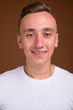 © Ranta Images - Face of young handsome man with blond hair smiling