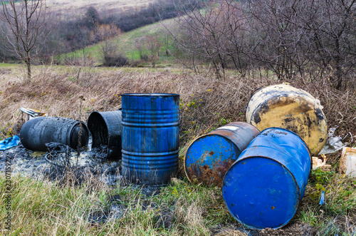 Barrels of toxic waste in nature