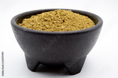 Fotografie, Obraz Bulk Maeng Da Kratom powder in black bowl on white background