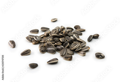 Fotomural Sunflower (Helianthus annuus) seeds, isolated on white.