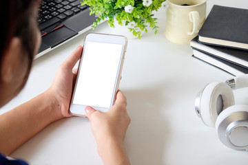 Closeup hand using mockup smartphone.