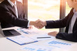 © Prathankarnpap - Business people shaking hands with finishing up meeting, Partnership and acquisition concept.
