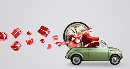 Wall Mural - Christmas countdown arriving. Santa Claus on car delivering New Year gifts and clock at gray background