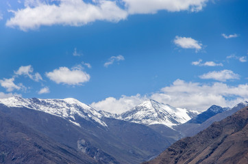 Desert and mountain over blue sky and white clouds on altiplano