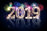 Fototapeta Do przedpokoju - colorful fireworks display and bright sparkler pyrotechnic number 2019 2018 change happy new year sylvester concept on black blue background