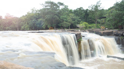 Tad Ton Waterfall Sing of Tad Ton National park in Chaiyaphum,Thailand, Concept rainy season waterfall travel must be careful damage caused by water change color It is a dangerous signal.