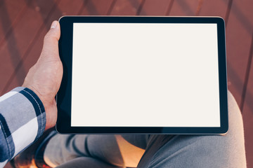 Poster - Mockup tablet screen, Man using tablet computer while Stand relax with Clipping path on screen for easy replace you design mock up