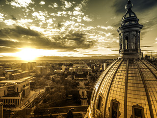 Poster - Aerial/Drone photograph of a sunset over the Colorado state capital building.  Capital city of Denver.  The Rocky Mountains can be seen on the horizon