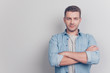© deagreez - Portrait of good-wearing gentleman stand isolated on light gray