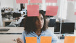 © supamotion - African American black employee looking onto a glass wall with sticky notes, framework for managing work, scrum methodology