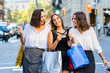 © karelnoppe - Threesome girl friends having fun shopping in city.