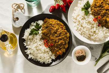 Wall Mural - Basmati rice with curry from vegetables and lentils. Healthy spicy vegan food.